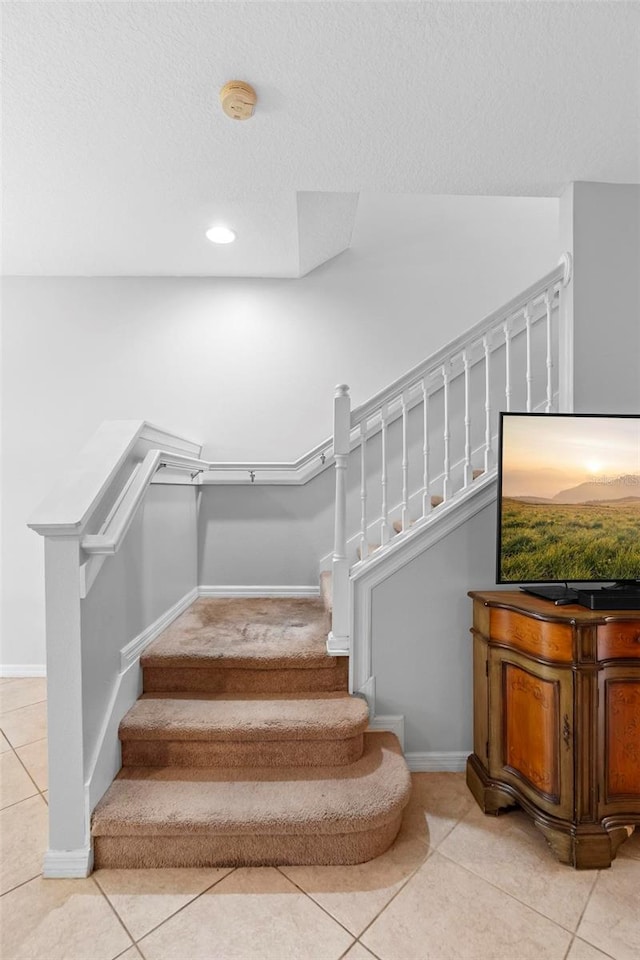 2829 Shady Willow Ln, Oviedo, FL 32765 - stairs featuring tile patterned flooring, baseboards, recessed lighting, and a textured ceiling