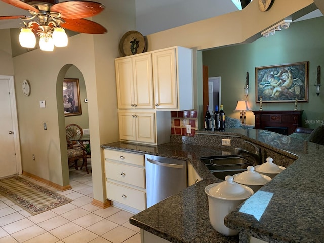 1585 Stefan Cole Ln, Apopka, FL 32703 - kitchen with arched walkways, a sink, stainless steel dishwasher, light tile patterned floors, and a ceiling fan
