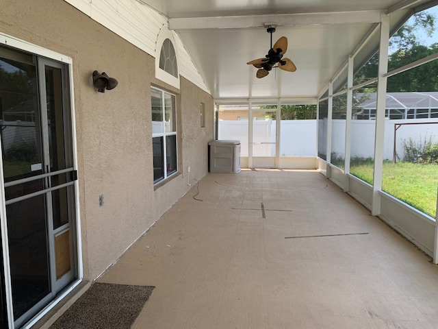 1585 Stefan Cole Ln, Apopka, FL 32703 - unfurnished sunroom with plenty of natural light, ceiling fan, and beamed ceiling