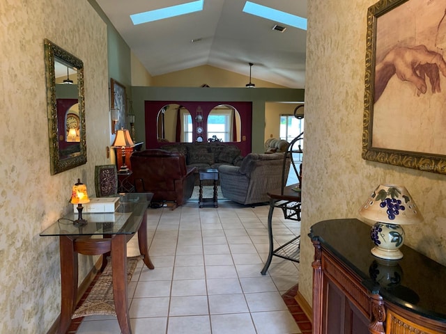 1585 Stefan Cole Ln, Apopka, FL 32703 - hall featuring a skylight, lofted ceiling, light tile patterned floors, and a textured wall
