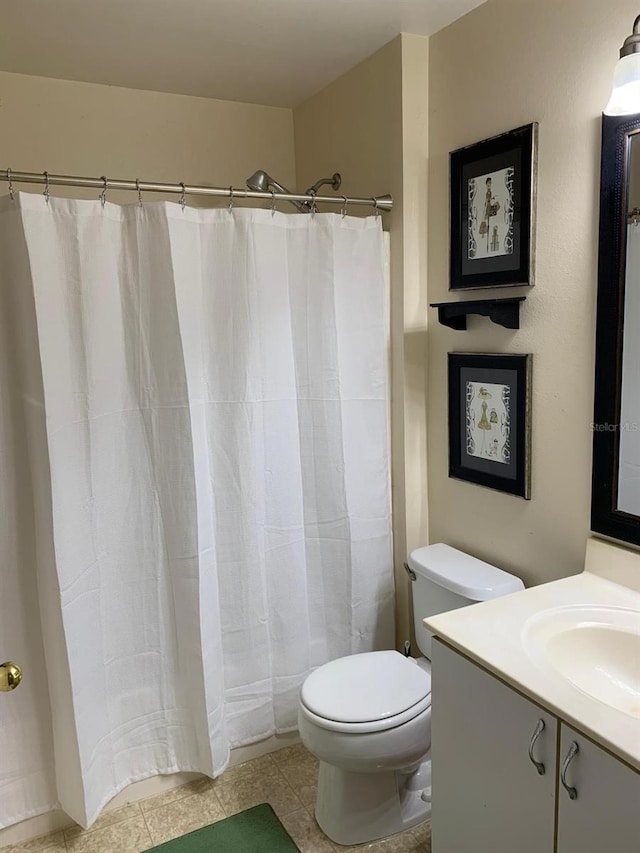 1585 Stefan Cole Ln, Apopka, FL 32703 - bathroom featuring toilet, vanity, tile patterned flooring, and a shower with curtain