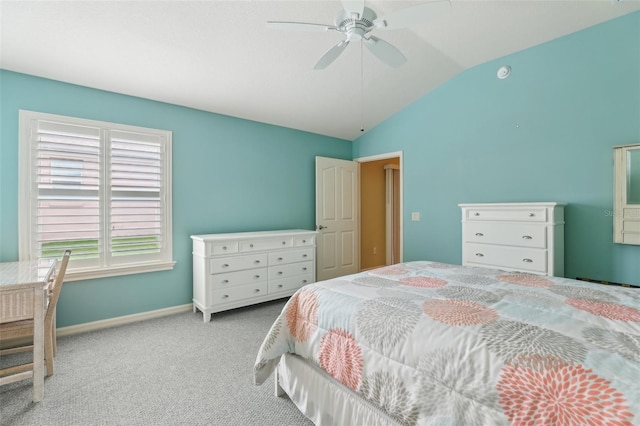 carpeted bedroom featuring lofted ceiling, baseboards, and ceiling fan