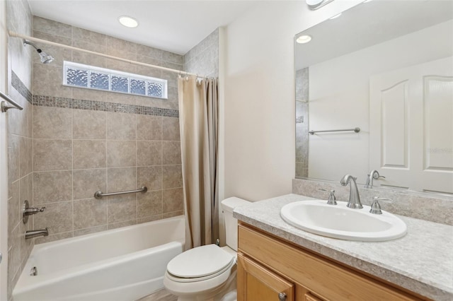 bathroom with shower / tub combo with curtain, toilet, and vanity