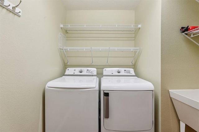 washroom featuring washer and dryer