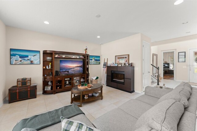 488 Kistler Cir, Clermont, FL 34715 - living area with baseboards, tile patterned flooring, recessed lighting, a fireplace, and stairway