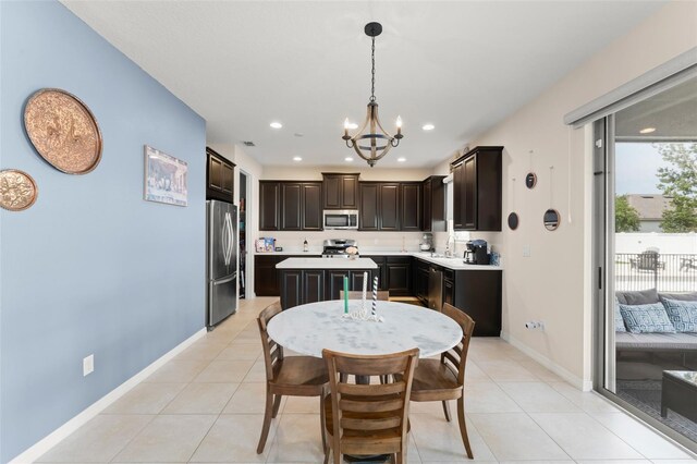 488 Kistler Cir, Clermont, FL 34715 - dining room featuring a chandelier, baseboards, light tile patterned floors, and recessed lighting