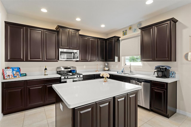 488 Kistler Cir, Clermont, FL 34715 - kitchen with stainless steel appliances, a sink, light countertops, light tile patterned floors, and a center island