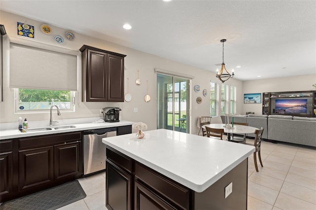 488 Kistler Cir, Clermont, FL 34715 - kitchen with dishwasher, a sink, light tile patterned floors, light countertops, and recessed lighting