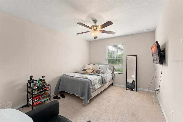 488 Kistler Cir, Clermont, FL 34715 - bedroom featuring baseboards, ceiling fan, light colored carpet, and a textured ceiling