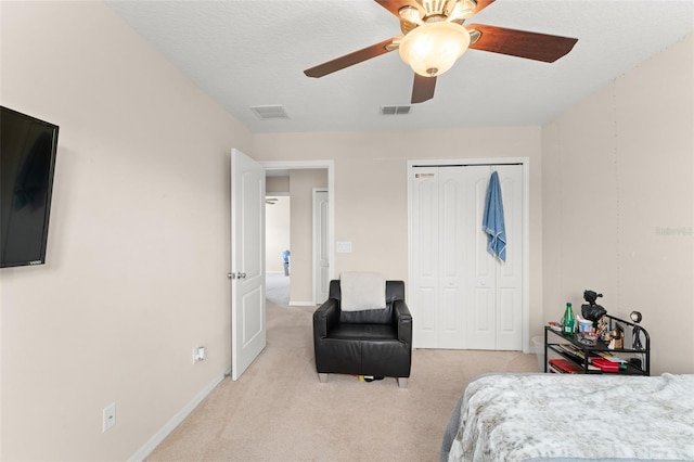 488 Kistler Cir, Clermont, FL 34715 - bedroom with light carpet, a closet, ceiling fan, and baseboards