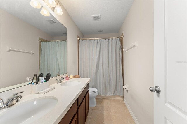488 Kistler Cir, Clermont, FL 34715 - full bathroom featuring tile patterned flooring, double vanity, toilet, and a shower with shower curtain