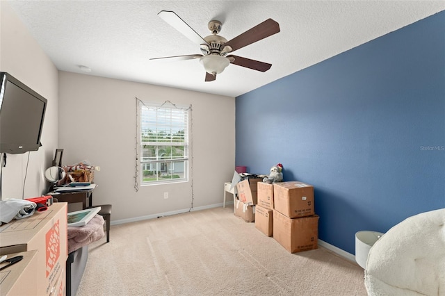 488 Kistler Cir, Clermont, FL 34715 - recreation room featuring a ceiling fan, light colored carpet, baseboards, and a textured ceiling
