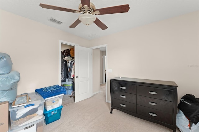 488 Kistler Cir, Clermont, FL 34715 - bedroom with light colored carpet, a closet, and ceiling fan