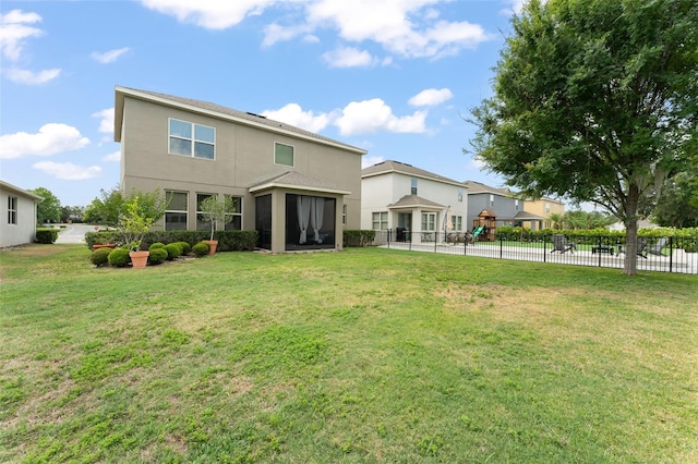 488 Kistler Cir, Clermont, FL 34715 - back of house with stucco siding and a sunroom