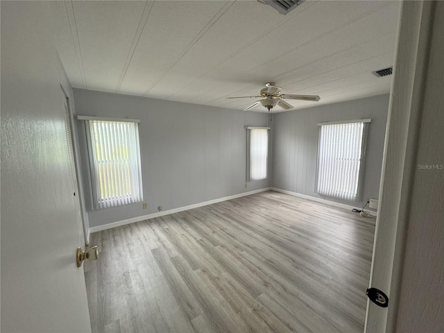 2116 Wax Myrtle Dr Unit Ge, Zellwood, FL 32798 - empty room with wood finished floors, ceiling fan, and baseboards