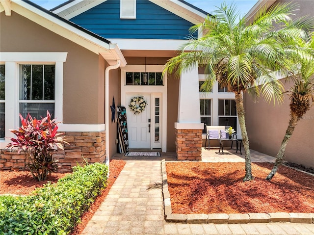 3380 Pawleys Loop N, Saint Cloud, FL 34769 - property entrance featuring stone siding and stucco siding