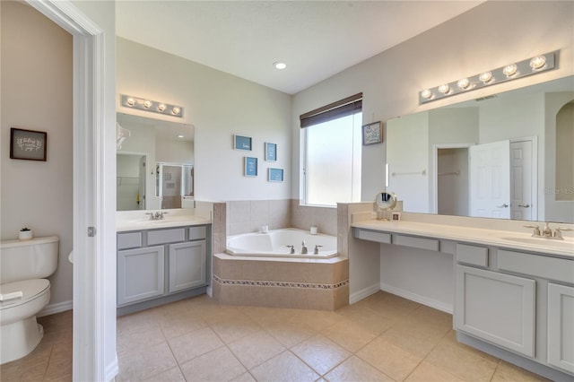 3380 Pawleys Loop N, Saint Cloud, FL 34769 - bathroom featuring toilet, tile patterned floors, a garden tub, vanity, and a stall shower