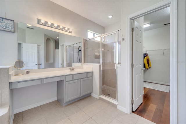 3380 Pawleys Loop N, Saint Cloud, FL 34769 - full bathroom featuring vanity, a shower stall, and a spacious closet