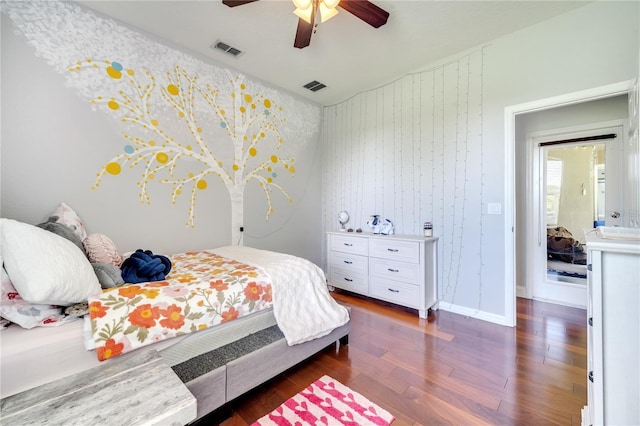 3380 Pawleys Loop N, Saint Cloud, FL 34769 - bedroom with dark wood-style floors and a ceiling fan