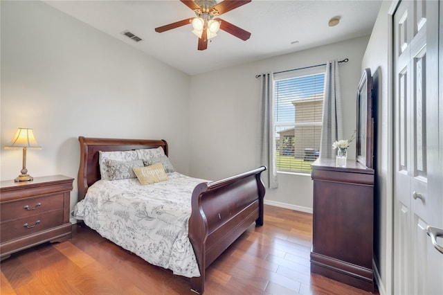 3380 Pawleys Loop N, Saint Cloud, FL 34769 - bedroom featuring dark wood-type flooring, baseboards, and ceiling fan