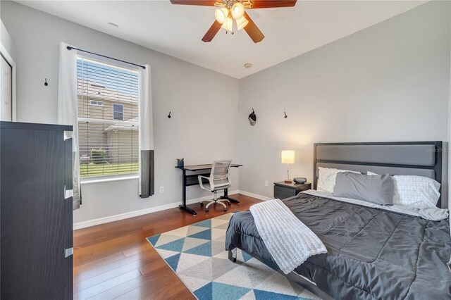 3380 Pawleys Loop N, Saint Cloud, FL 34769 - bedroom featuring multiple windows, wood finished floors, baseboards, and a ceiling fan