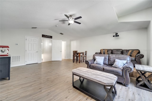 3380 Pawleys Loop N, Saint Cloud, FL 34769 - living area with ceiling fan, vaulted ceiling, light wood-style flooring, and baseboards