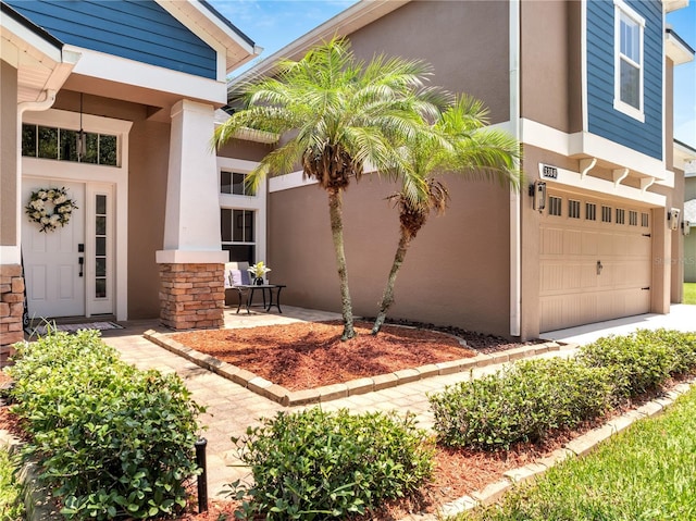 3380 Pawleys Loop N, Saint Cloud, FL 34769 - entrance to property with stucco siding and a garage