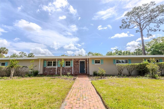 2001 Lily Ct, Sanford, FL 32771 - single story home with a front yard and brick siding