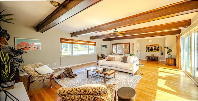 2001 Lily Ct, Sanford, FL 32771 - living area with light wood-type flooring, baseboards, beamed ceiling, and a ceiling fan