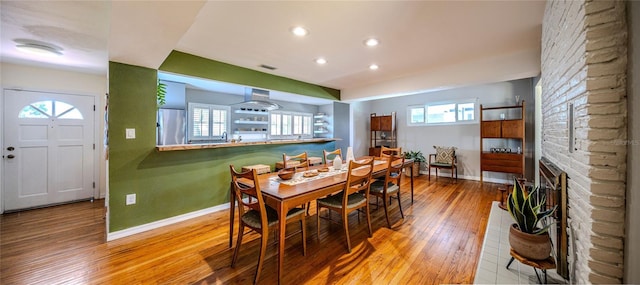 2001 Lily Ct, Sanford, FL 32771 - dining area featuring baseboards, wood finished floors, recessed lighting, and a brick fireplace