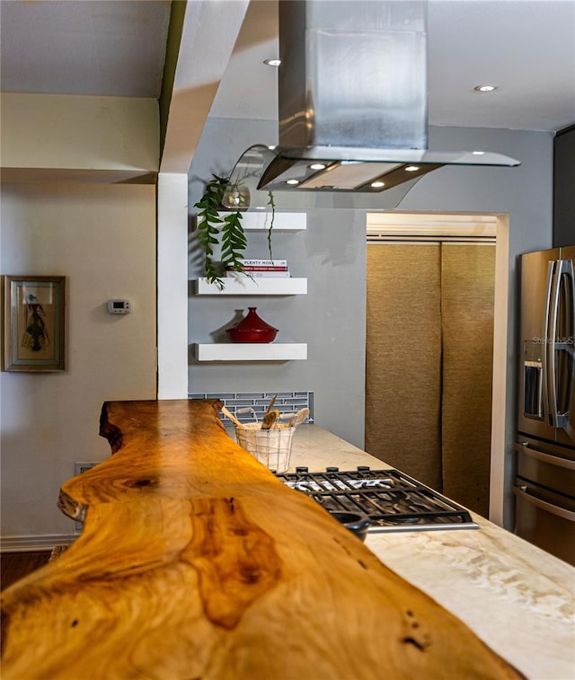 2001 Lily Ct, Sanford, FL 32771 - kitchen with stainless steel fridge with ice dispenser and island range hood