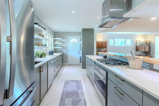 2001 Lily Ct, Sanford, FL 32771 - kitchen with appliances with stainless steel finishes, gray cabinets, open shelves, exhaust hood, and recessed lighting