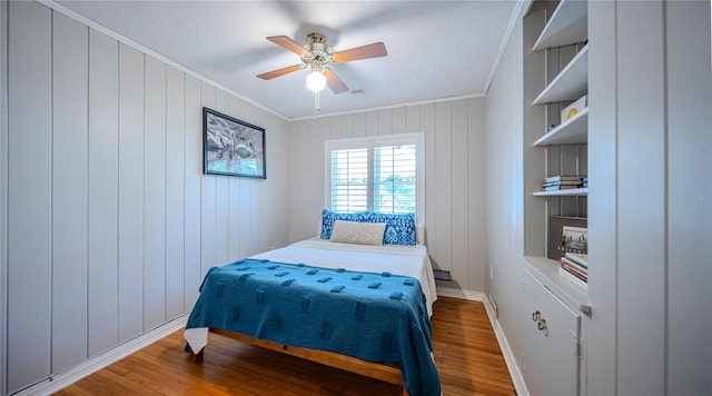 2001 Lily Ct, Sanford, FL 32771 - bedroom featuring crown molding, wood finished floors, baseboards, and a ceiling fan