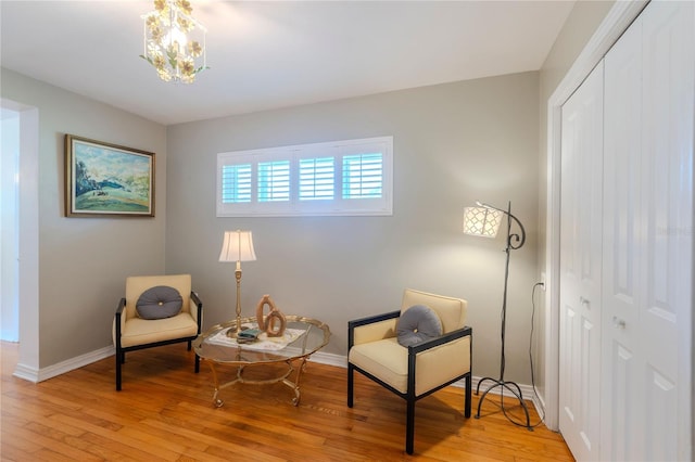 2001 Lily Ct, Sanford, FL 32771 - living area with light wood-type flooring, baseboards, and a chandelier