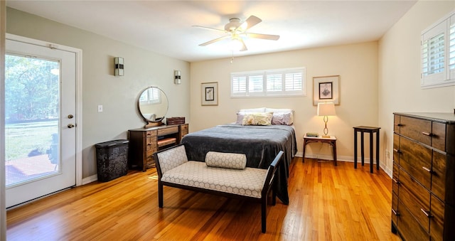 2001 Lily Ct, Sanford, FL 32771 - bedroom featuring multiple windows, light wood-style flooring, access to exterior, and ceiling fan