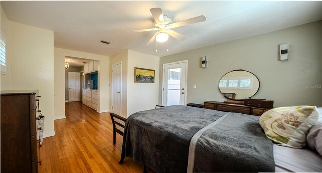 2001 Lily Ct, Sanford, FL 32771 - bedroom with light wood-style floors, a ceiling fan, and baseboards