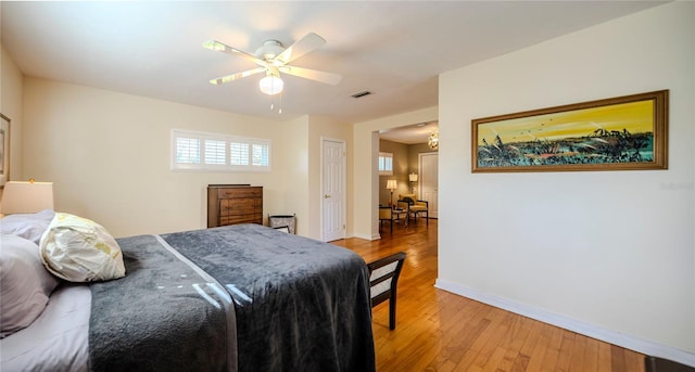 2001 Lily Ct, Sanford, FL 32771 - bedroom with baseboards, light wood-style floors, and a ceiling fan