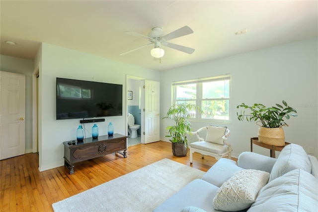 2001 Lily Ct, Sanford, FL 32771 - living area featuring a ceiling fan, hardwood / wood-style flooring, and baseboards