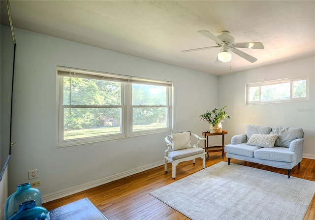 2001 Lily Ct, Sanford, FL 32771 - living area featuring wood finished floors, a ceiling fan, and baseboards