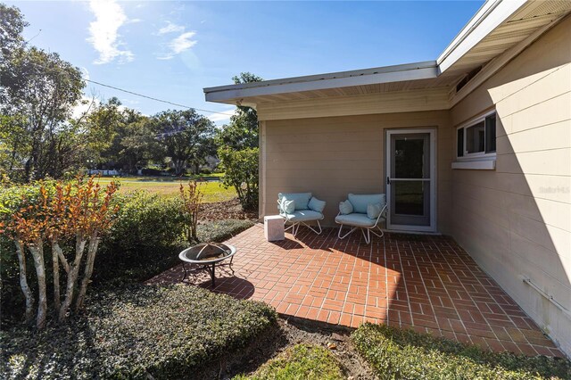 2001 Lily Ct, Sanford, FL 32771 - view of patio featuring an outdoor fire pit