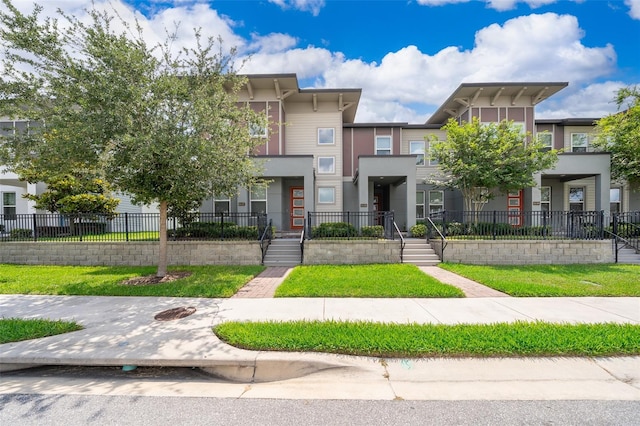 6132 Bimini Twist Loop, Orlando, FL 32819 - view of front of home with fence and stucco siding