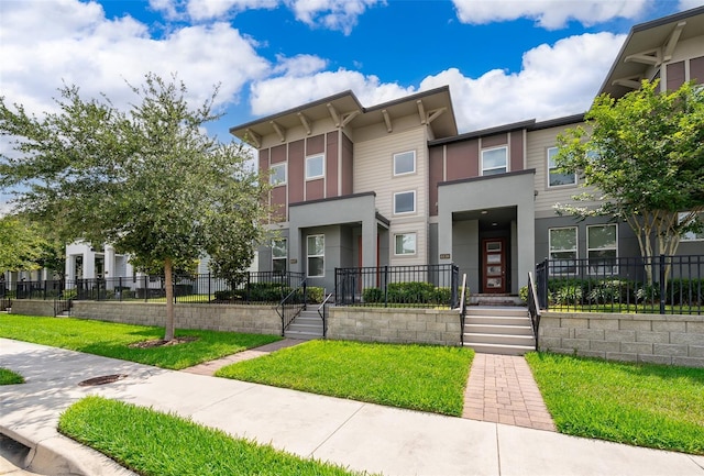 6132 Bimini Twist Loop, Orlando, FL 32819 - view of front facade featuring fence and stucco siding