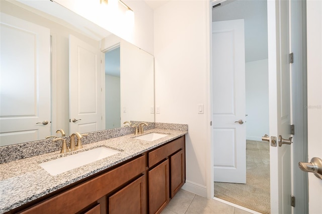 6132 Bimini Twist Loop, Orlando, FL 32819 - bathroom with double vanity, tile patterned floors, and baseboards