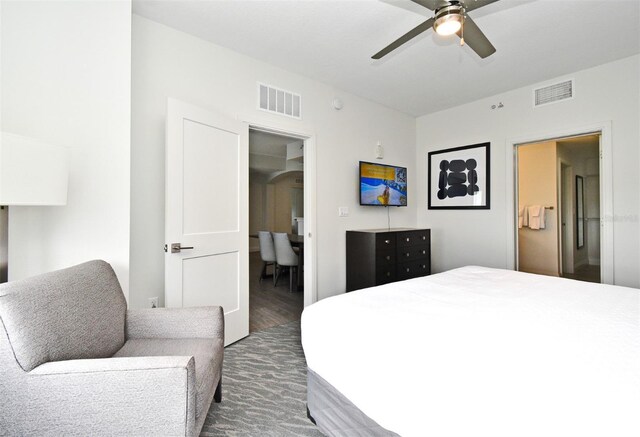 14501 Grove Resort Ave Unit 3741, Winter Garden, FL 34787 - bedroom featuring arched walkways, wood finished floors, and ceiling fan
