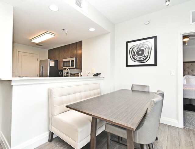 14501 Grove Resort Ave Unit 3741, Winter Garden, FL 34787 - dining area with baseboards, light wood-style floors, and recessed lighting