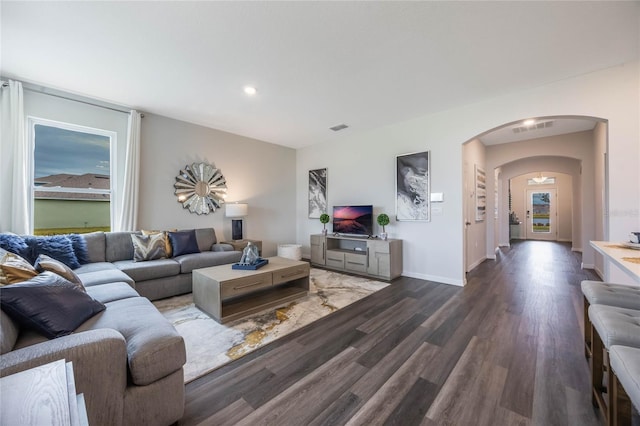 1974 Walnut Creek Dr, Kissimmee, FL 34744 - living area featuring arched walkways, wood finished floors, baseboards, and recessed lighting