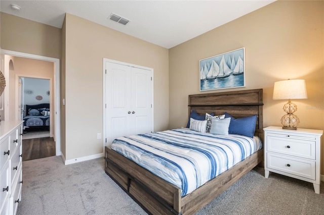 1974 Walnut Creek Dr, Kissimmee, FL 34744 - bedroom with light colored carpet, a closet, and baseboards