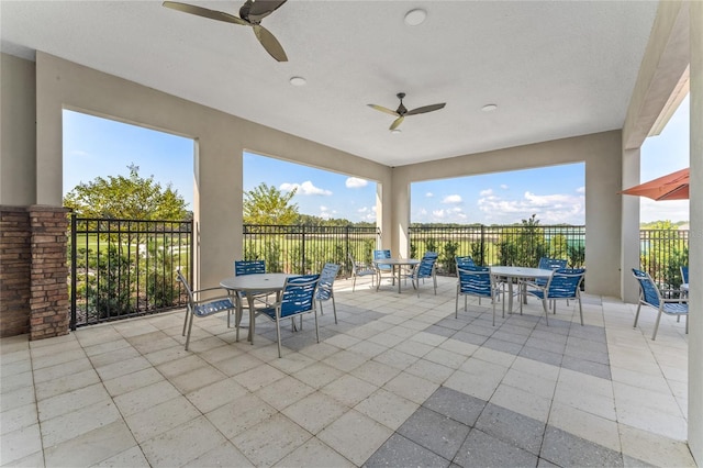 1974 Walnut Creek Dr, Kissimmee, FL 34744 - view of patio / terrace with outdoor dining area, ceiling fan, and fence