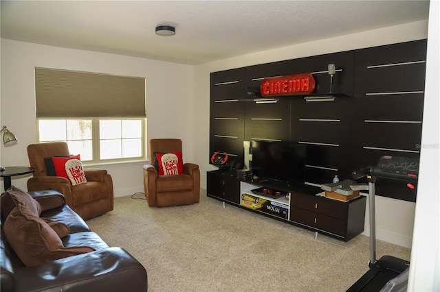 living area with light carpet and baseboards