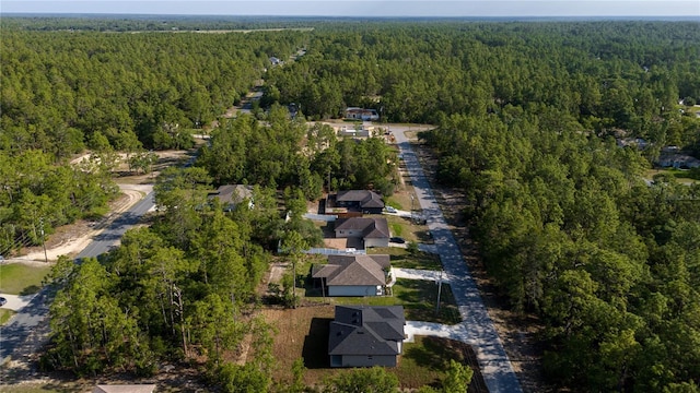 aerial view of property's location with a forest